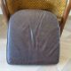 Colonial style armchair in woven rattan and exotic wood