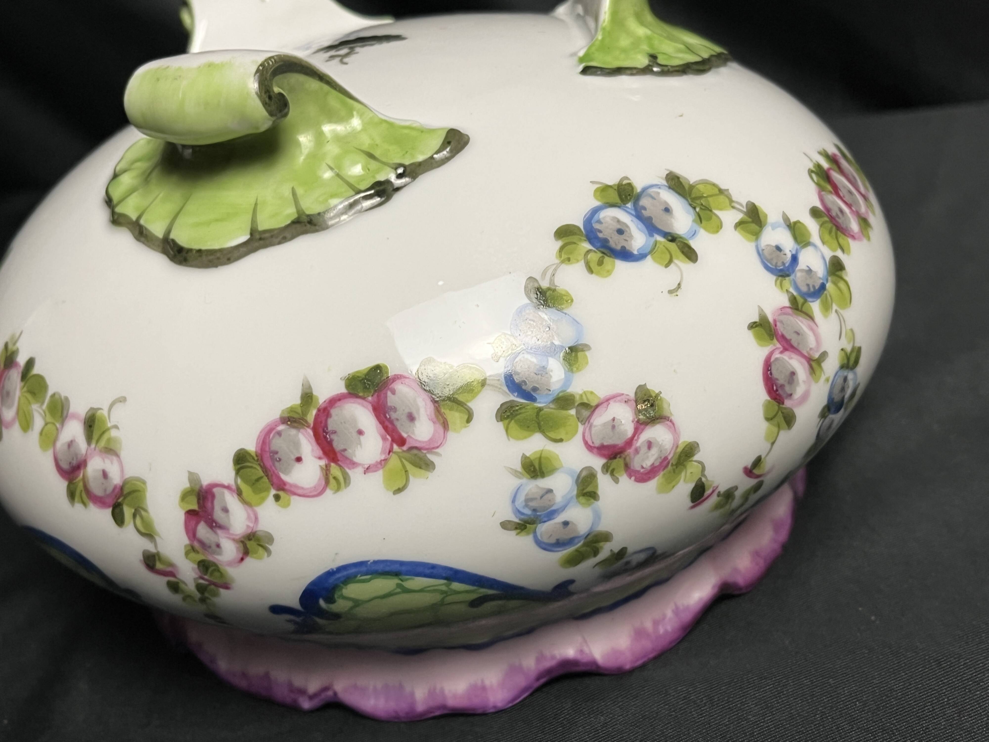 Sèvres, 20th century porcelain tripod planter with floral decoration