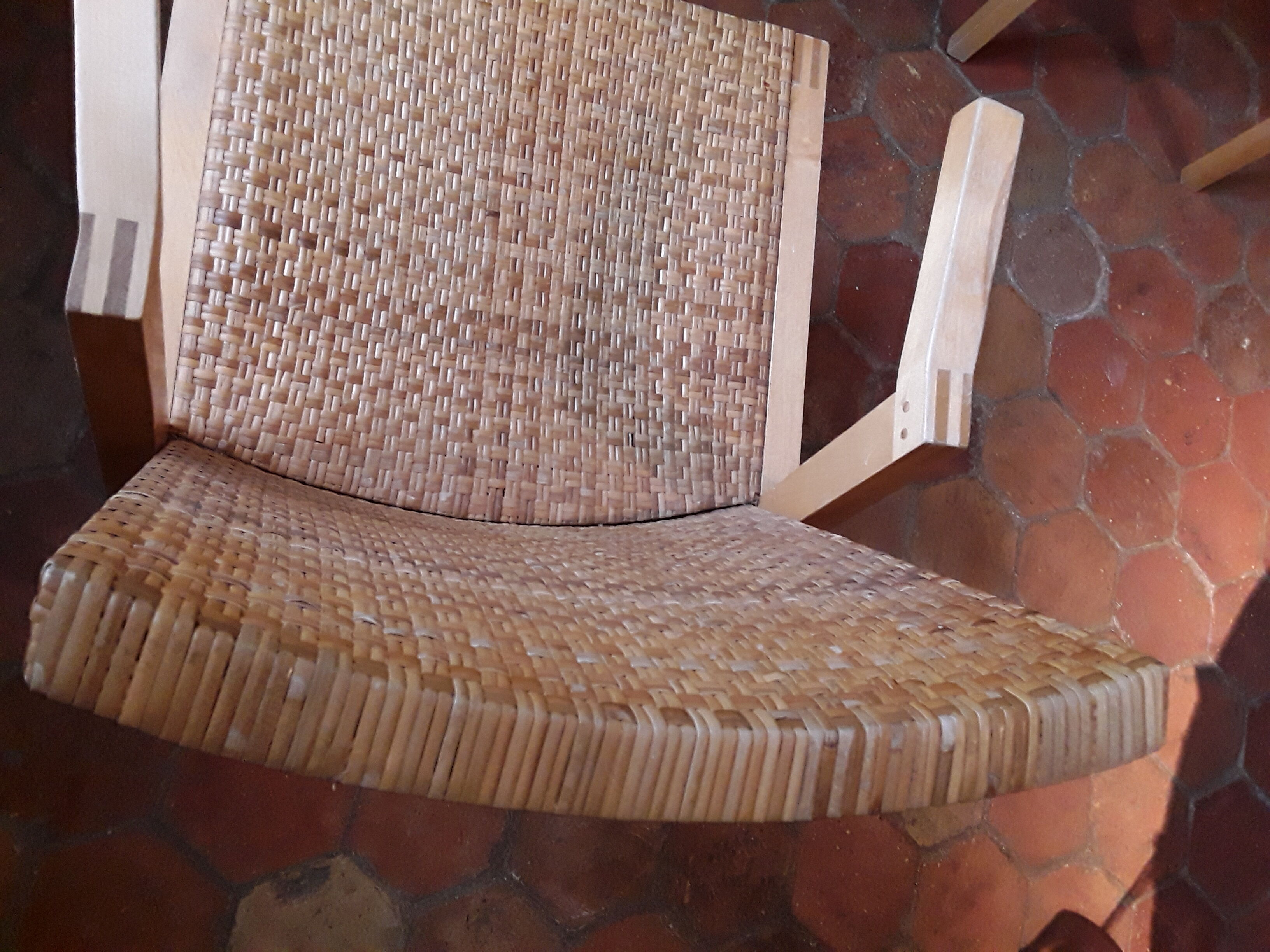 Two vintage braided straw armchairs