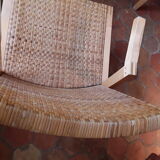 Two vintage braided straw armchairs