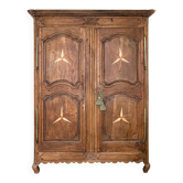 Antique French rustic wardrobe with star inlays.