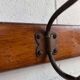 Vintage industrial wooden coat rack with porcelain hooks
