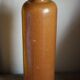 Vintage stoneware liqueur bottle