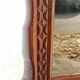 Tramp Art mirror from the 19th century in hand-carved wood.