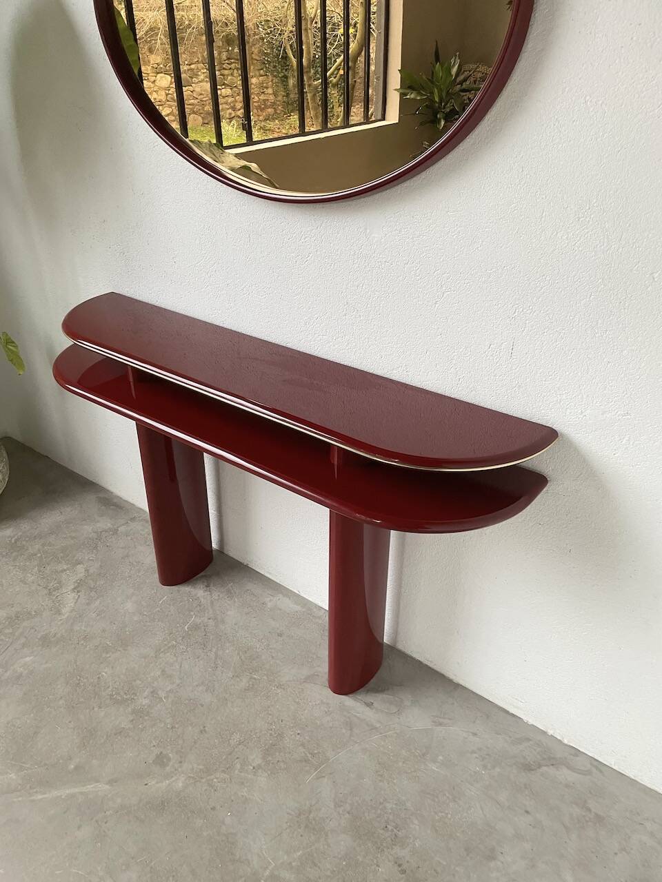 Red lacquered console and its mirror from the 80s