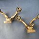 Pair of bronze wall sconces with 1940s Art Deco lampshades.