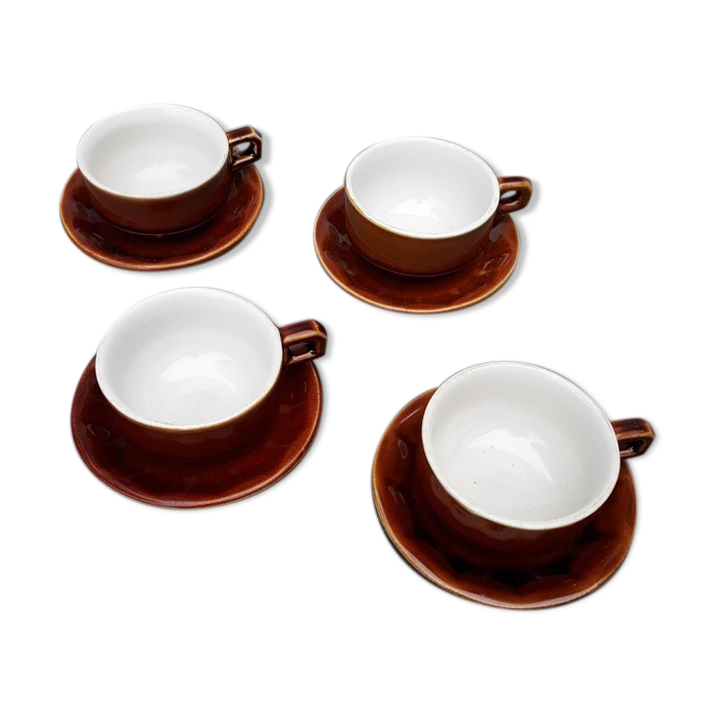 Old cups and under cups of coffee - brown ceramics typical of station buffets