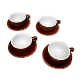 Old cups and under cups of coffee - brown ceramics typical of station buffets