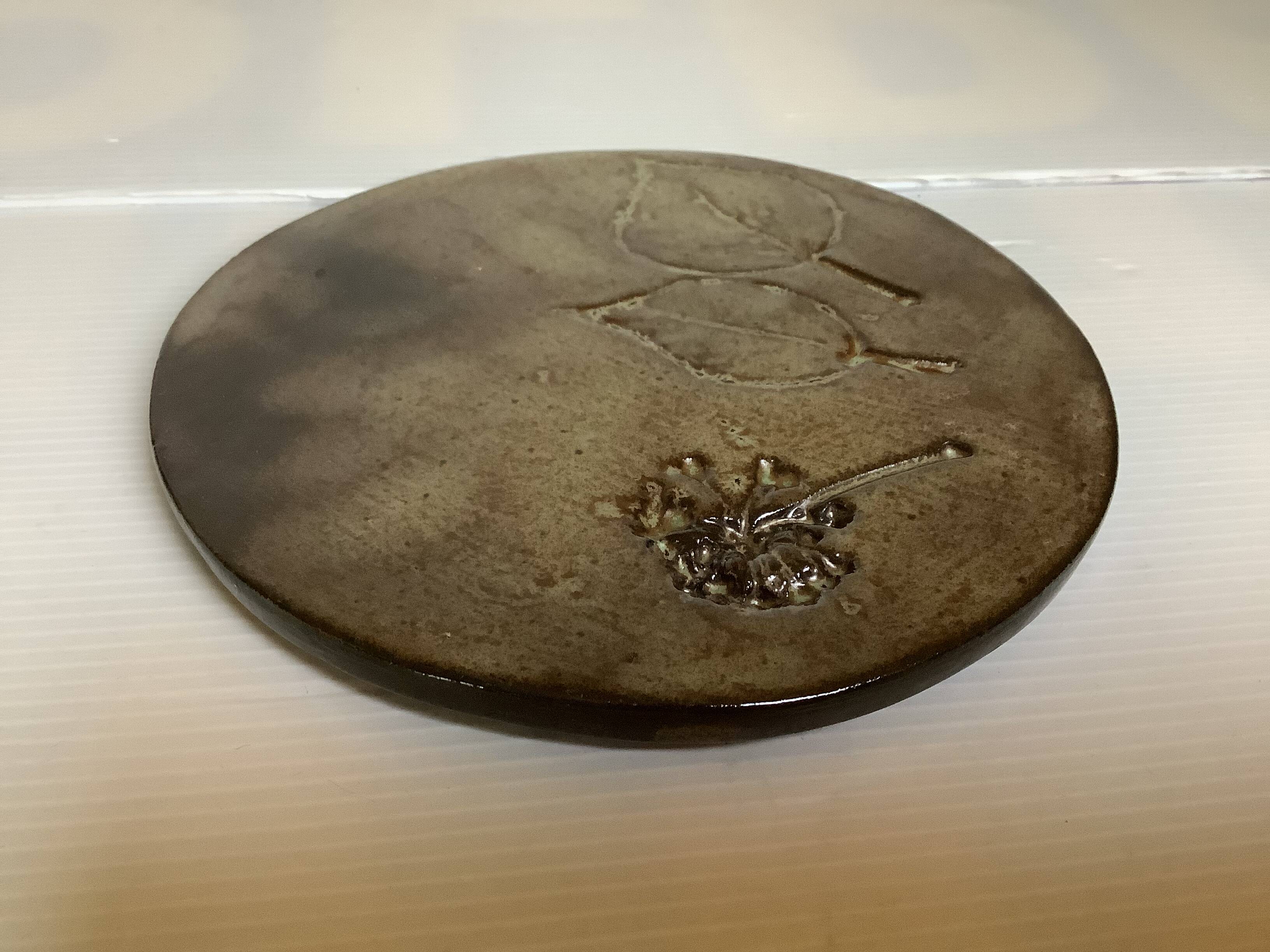 Brown ceramic trivet