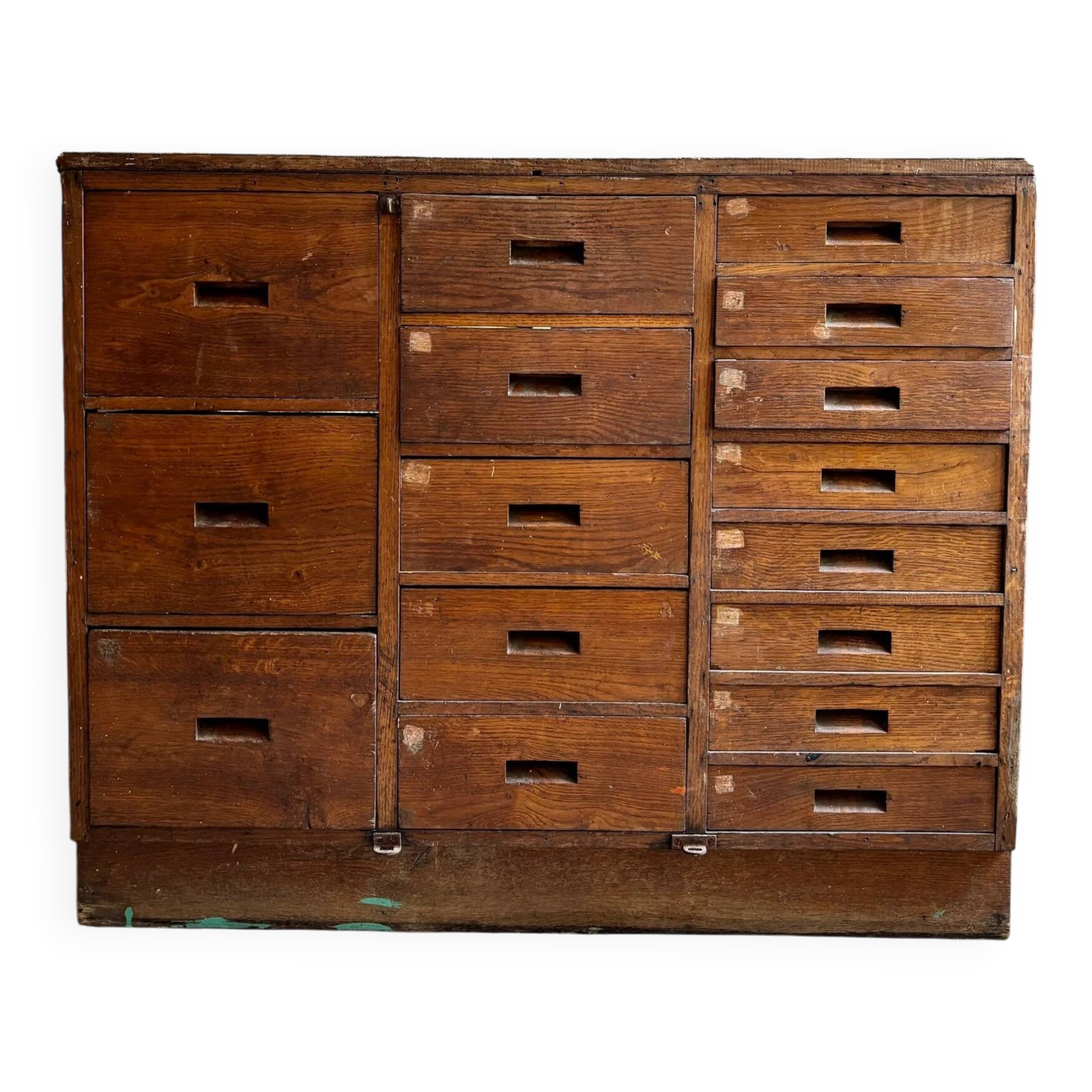 Craftsman's cabinet with 16 drawers in dark wood.