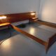 Double bed in vintage Scandinavian style from the 1960s with bedside tables.