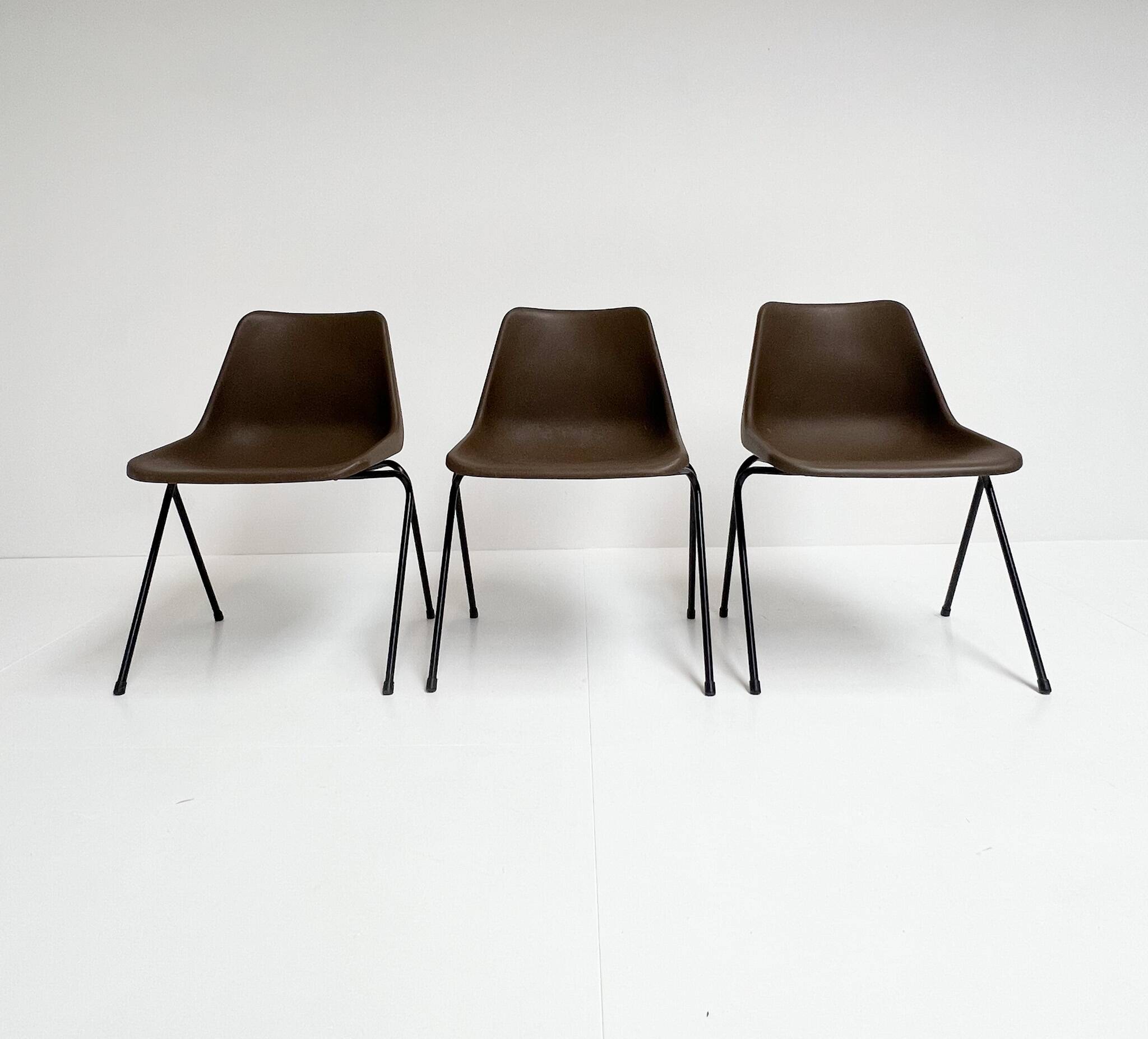 Brown and black set of 6 Polyprop chairs on a metal frame. The Polyprop cha