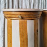 A pair of distressed bedside tables.