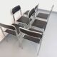 Set of 6 vintage Italian stackable chairs in chrome metal and faux leather.