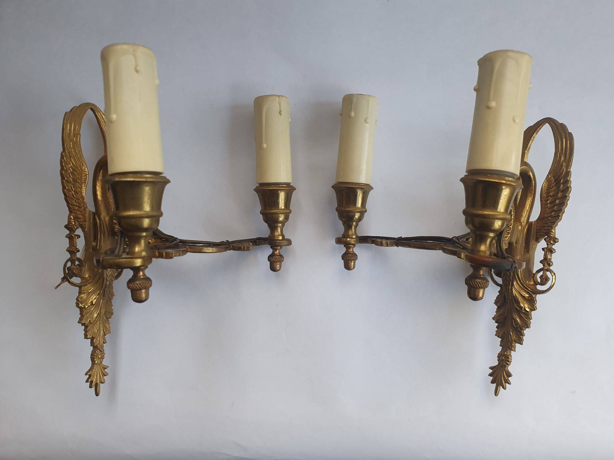 Pair of wall sconces candle holders in Empire style in bronze