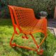 Orange pierced sheet metal bench