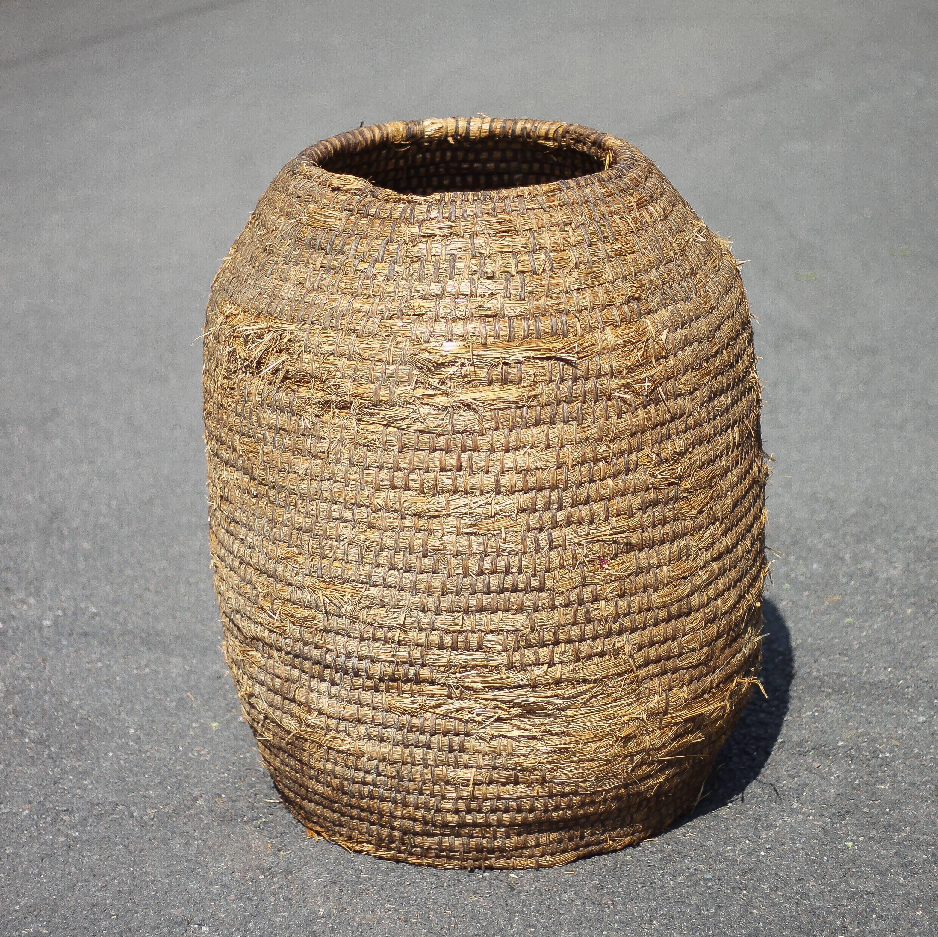 Very large old basket, burgundy straw and bramble, woven basket