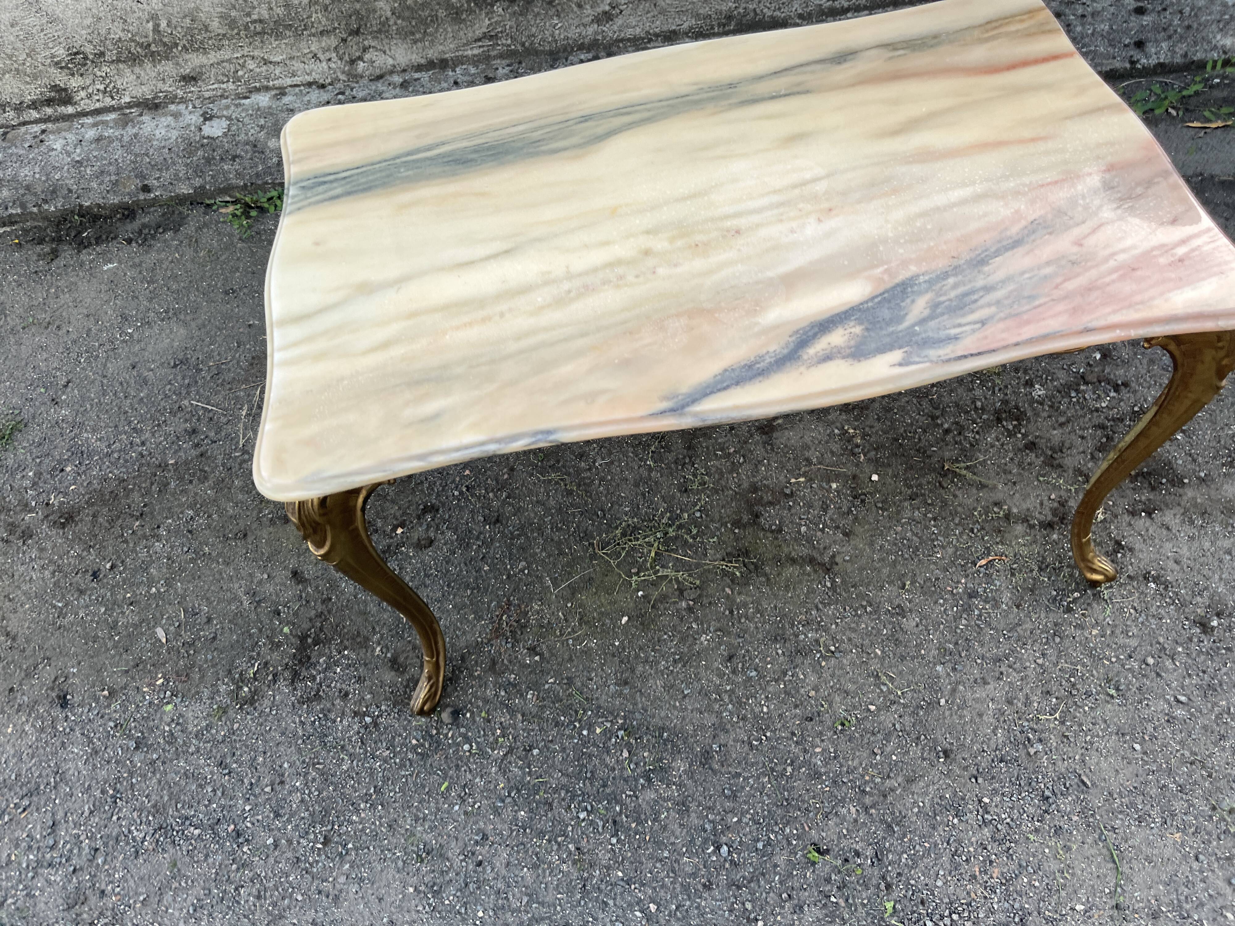 Gilded brass coffee table with onyx top