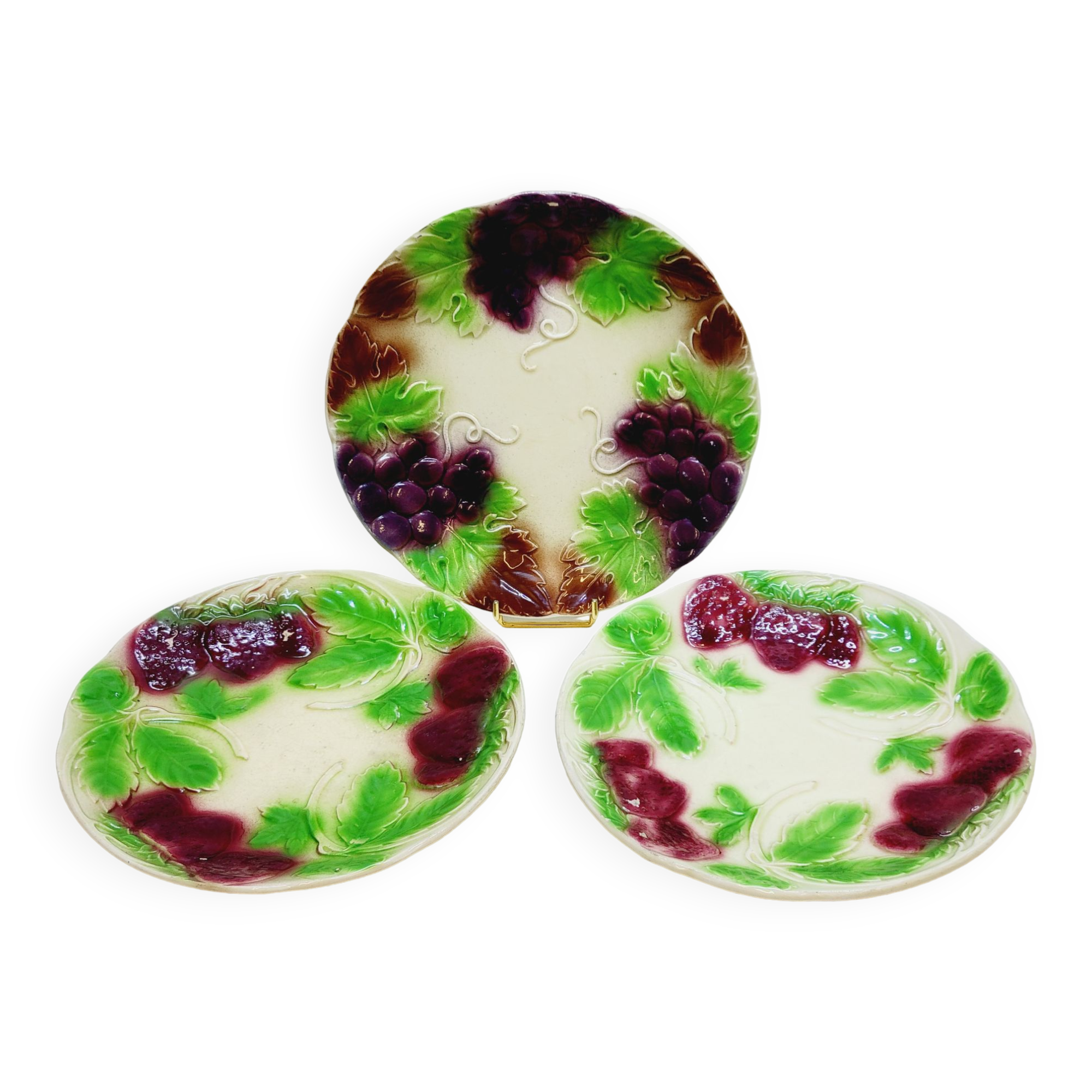 3 old plates in slip decoration strawberries and grapes