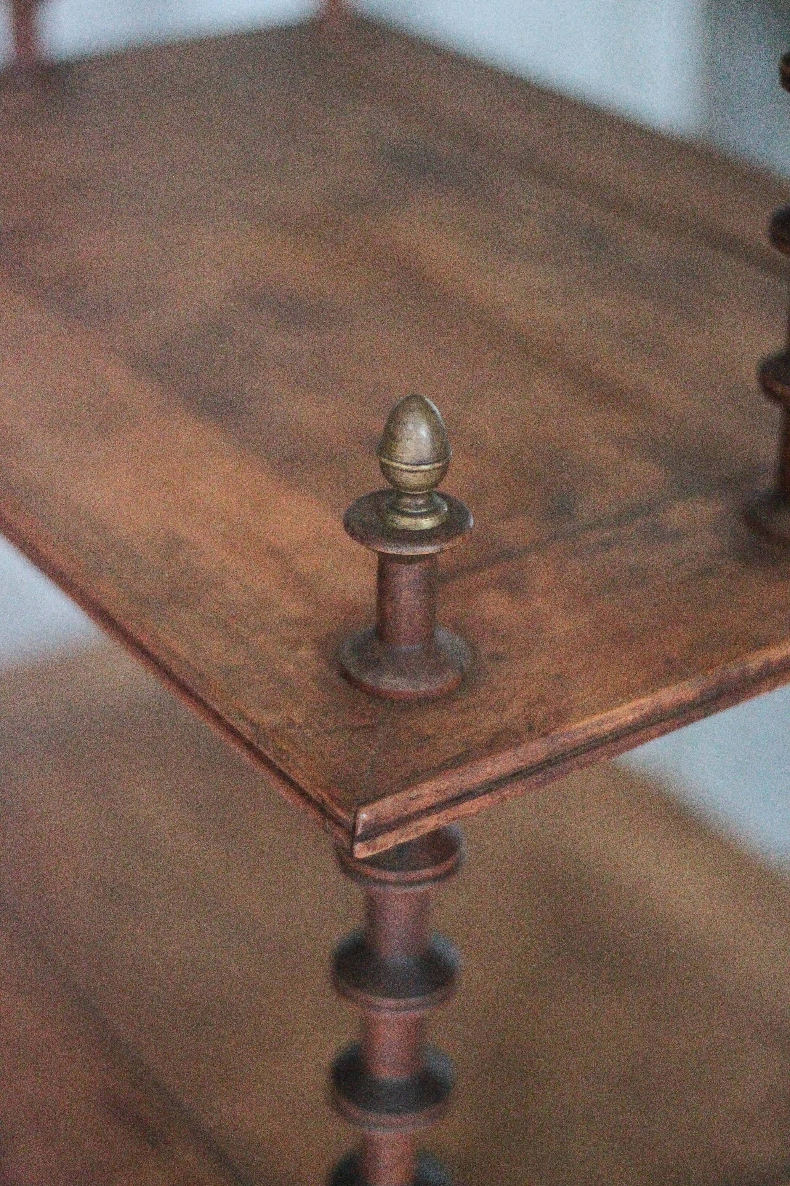 Napoleon III spool shelf, floor-standing shelf with brass tips.