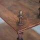 Napoleon III spool shelf, floor-standing shelf with brass tips.