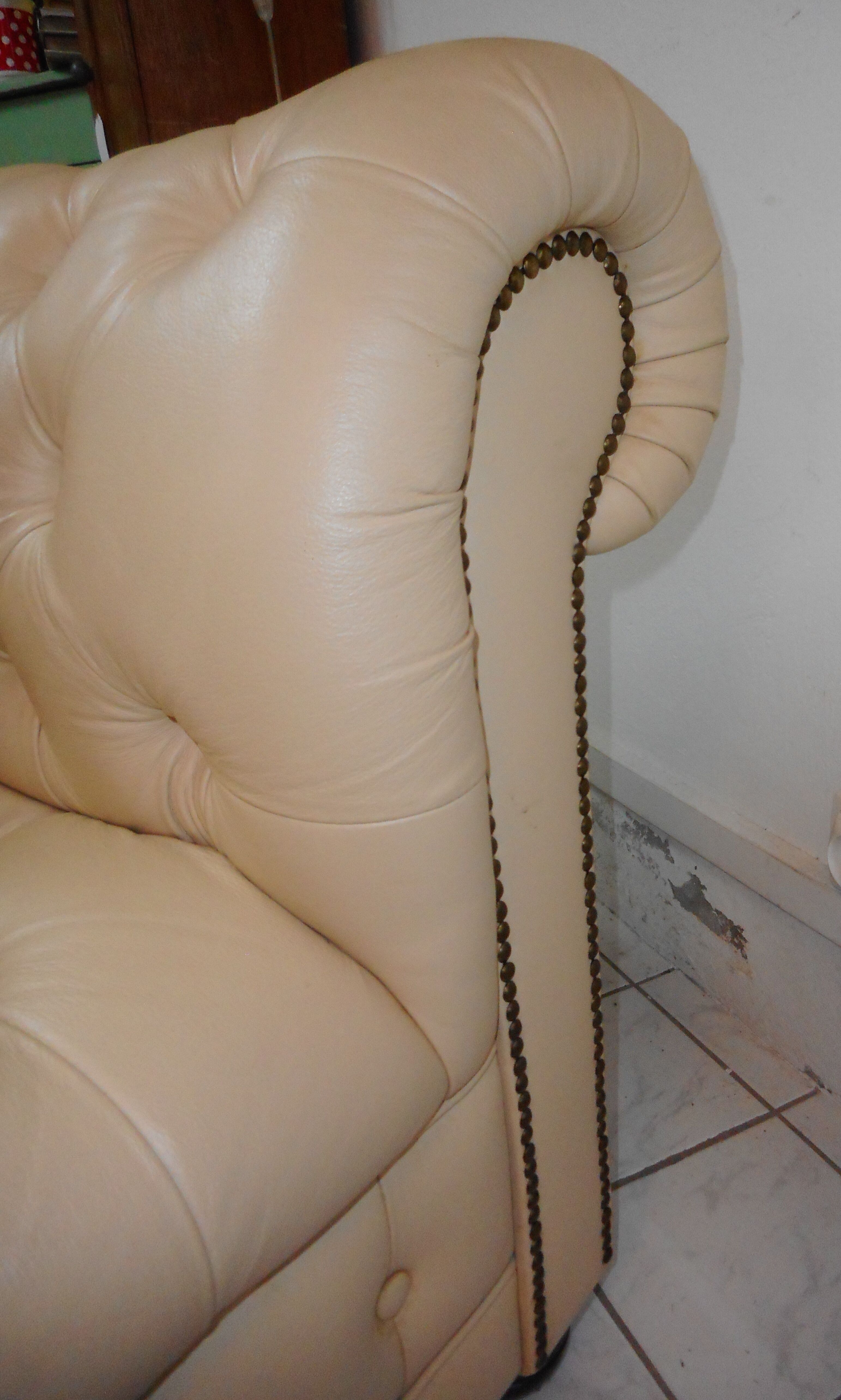 Beige leather chesterfield sofa