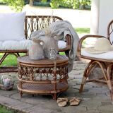 Rattan bench with white cushion