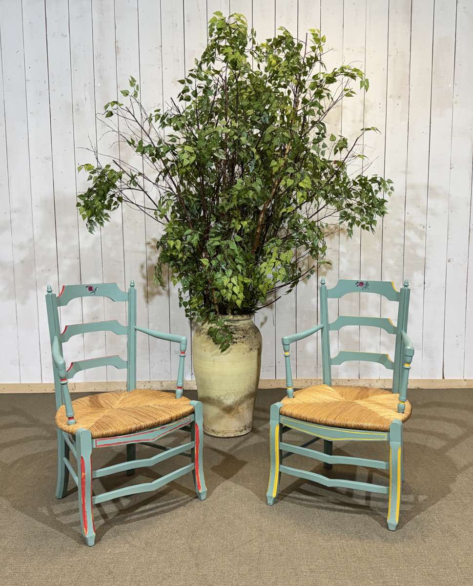 Pair of rustic armchairs in beech with straw seats.