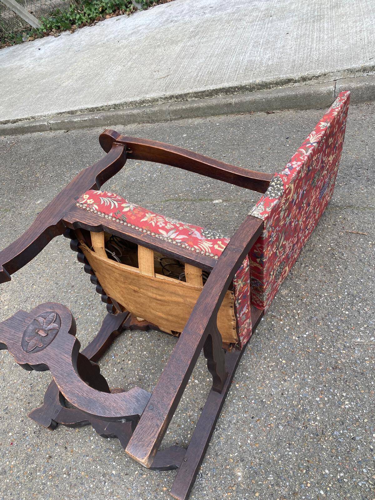 Henri II armchair in solid wood and floral burgundy fabric, 19th century.