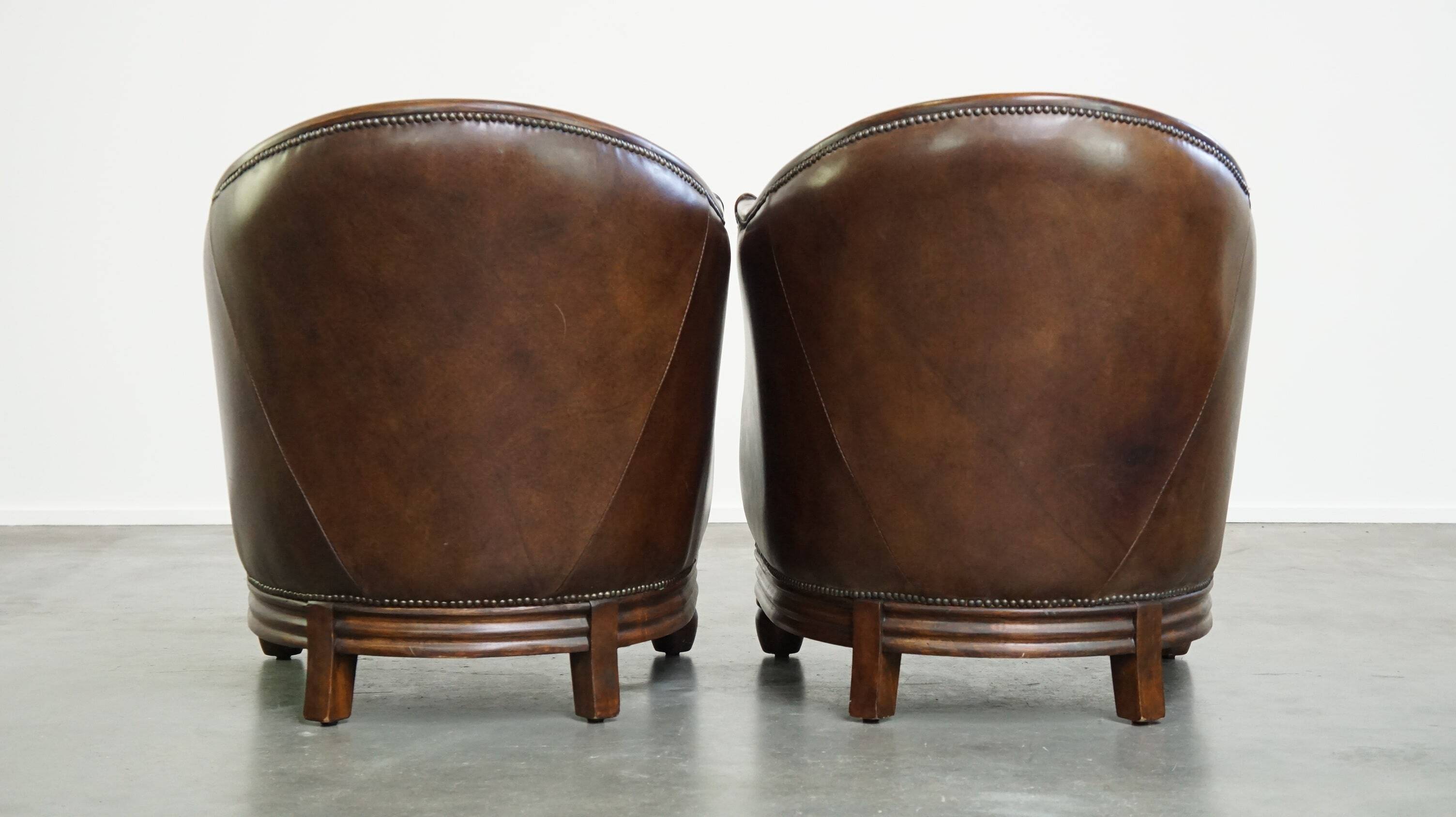 Set of 2 club chairs/armchairs in dark cognac leather