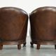 Set of 2 club chairs/armchairs in dark cognac leather
