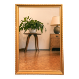 Vintage rectangular gilt mirror, molded wooden frame with beads and fire