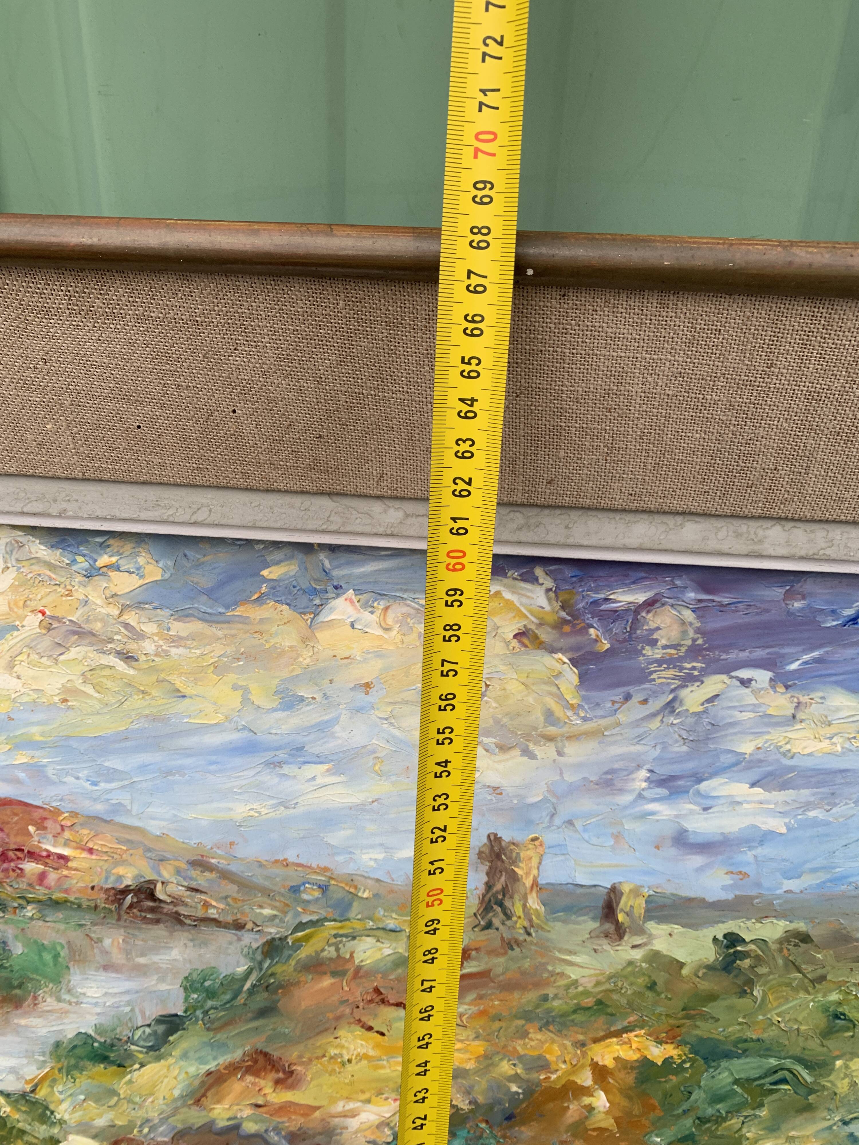 Colorful landscape painting with a river and hills signed Benjam