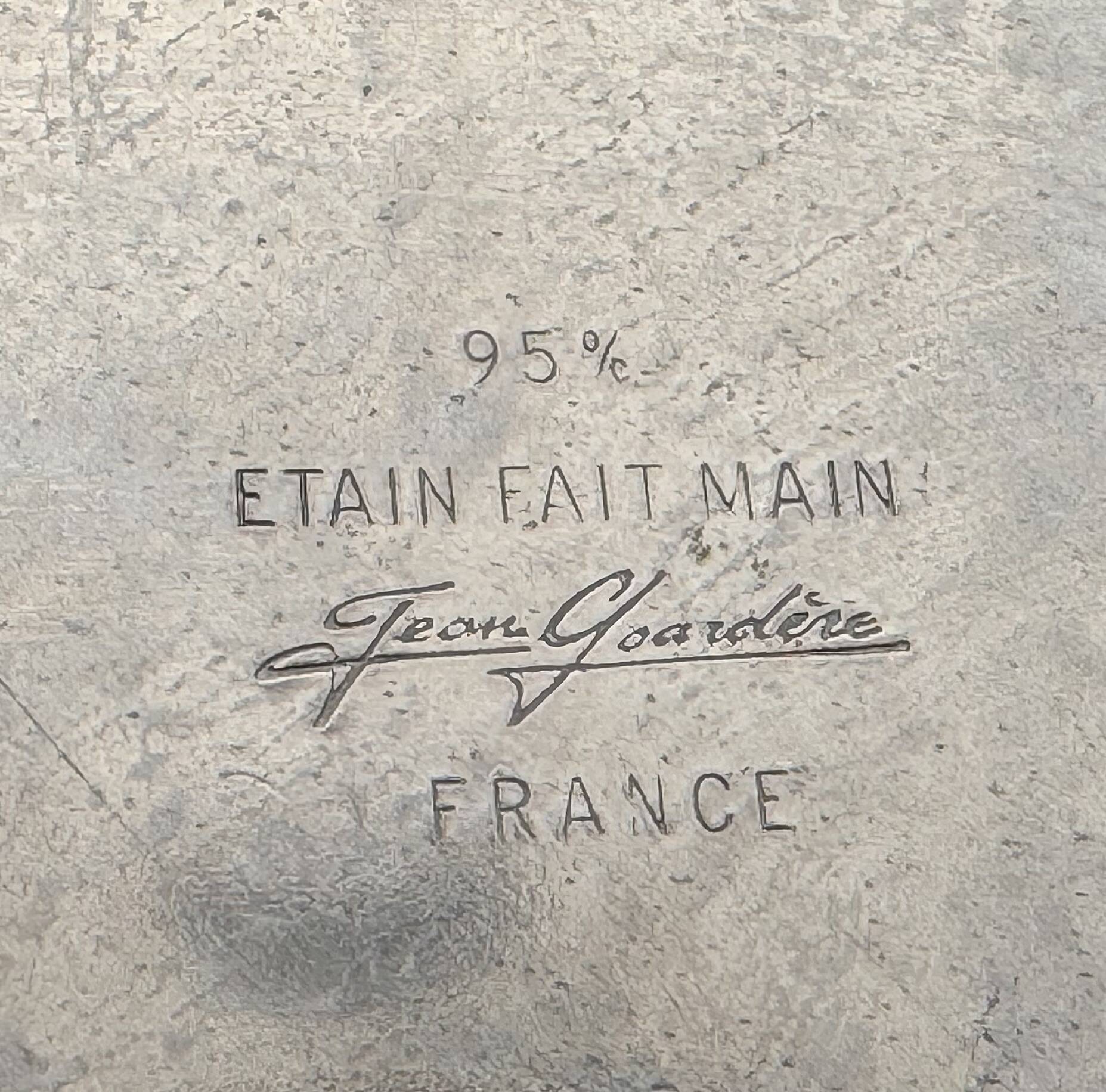Pure tin sun vase at 95%, signed Jean Goardère.