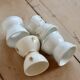 4 mismatched vintage diabolo egg cups in earthenware