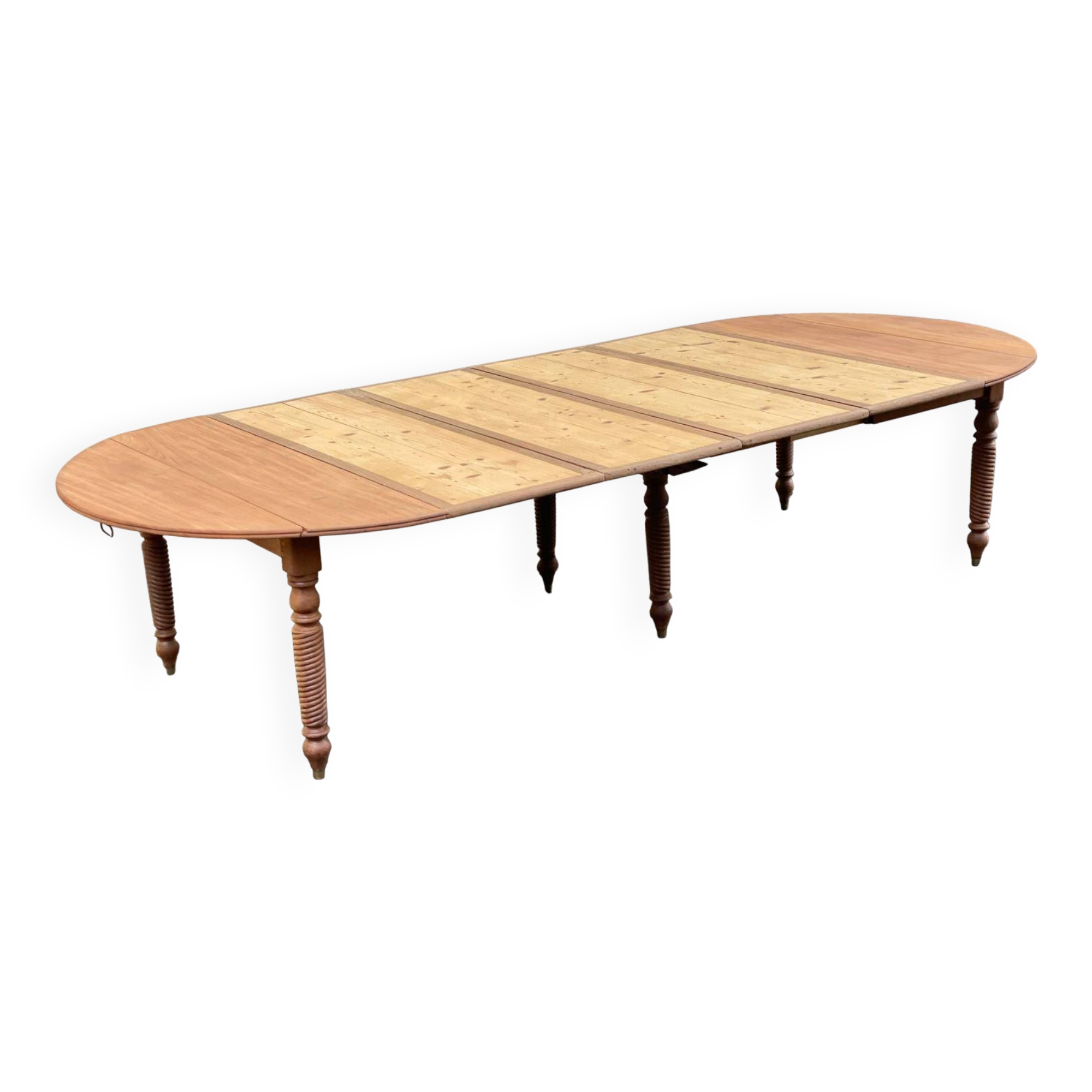 Round extendable banquet table stripped in solid mahogany with 4 extensions, 19th century.