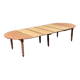 Round extendable banquet table stripped in solid mahogany with 4 extensions, 19th century.