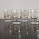 8 glasses with white granite band and gold edging from the 1950s