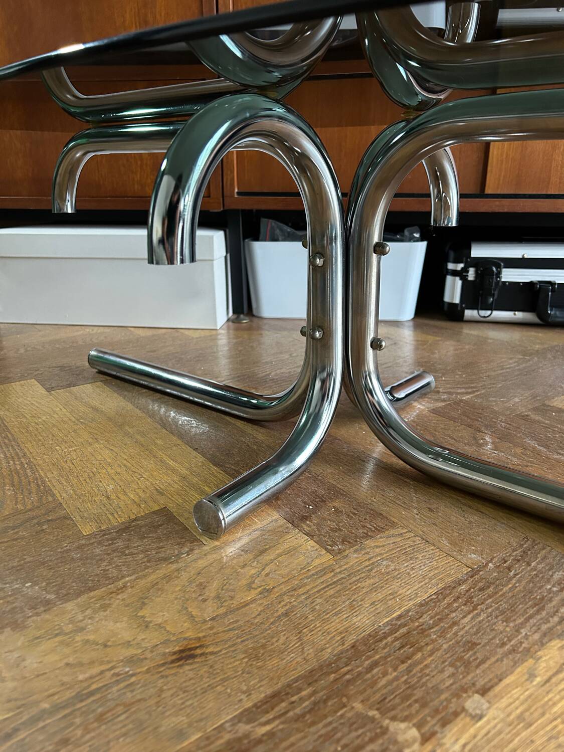 70s design oval coffee table in smoked black glass with chrome legs.