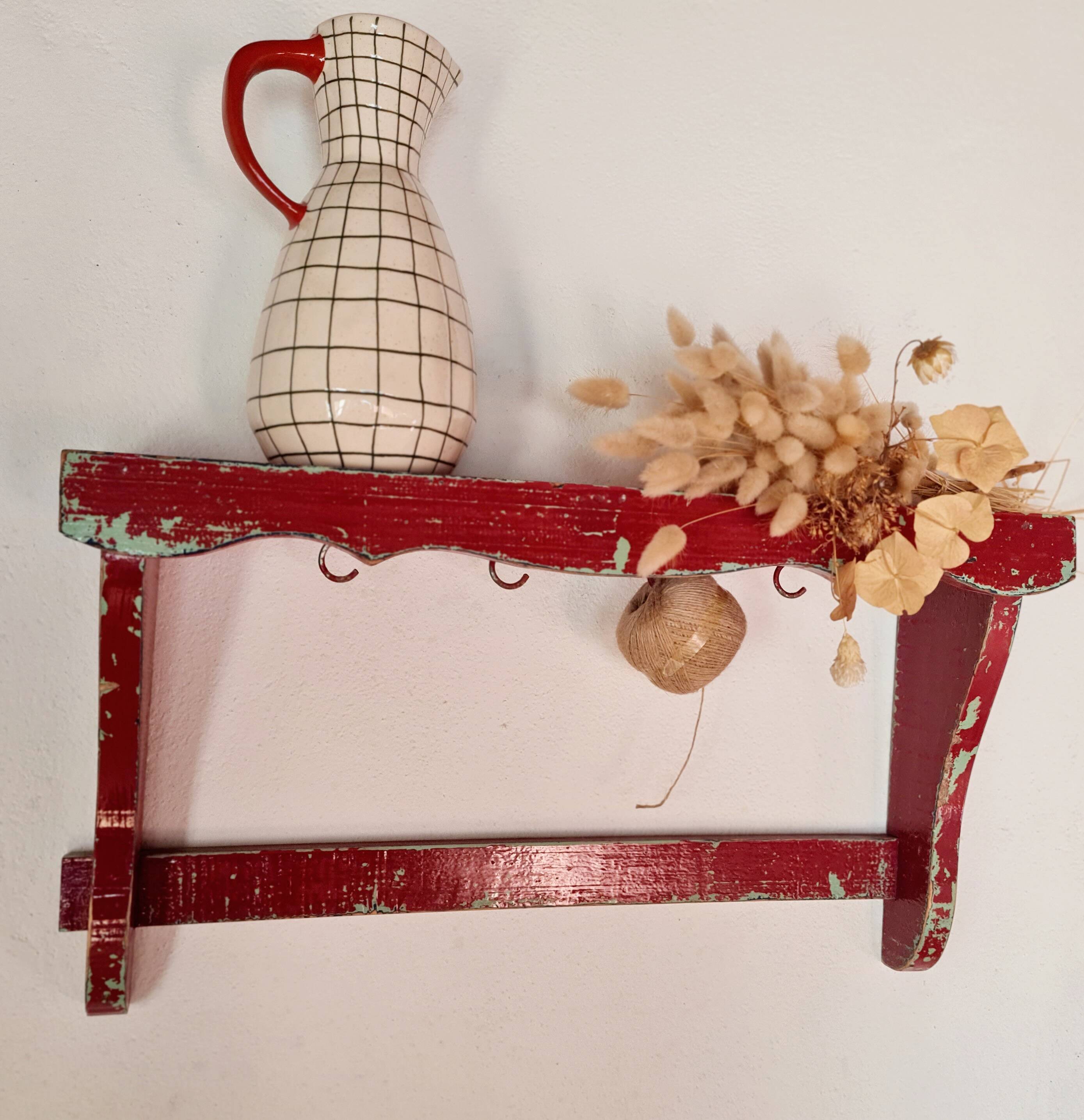 Wall shelf in garnet red wood