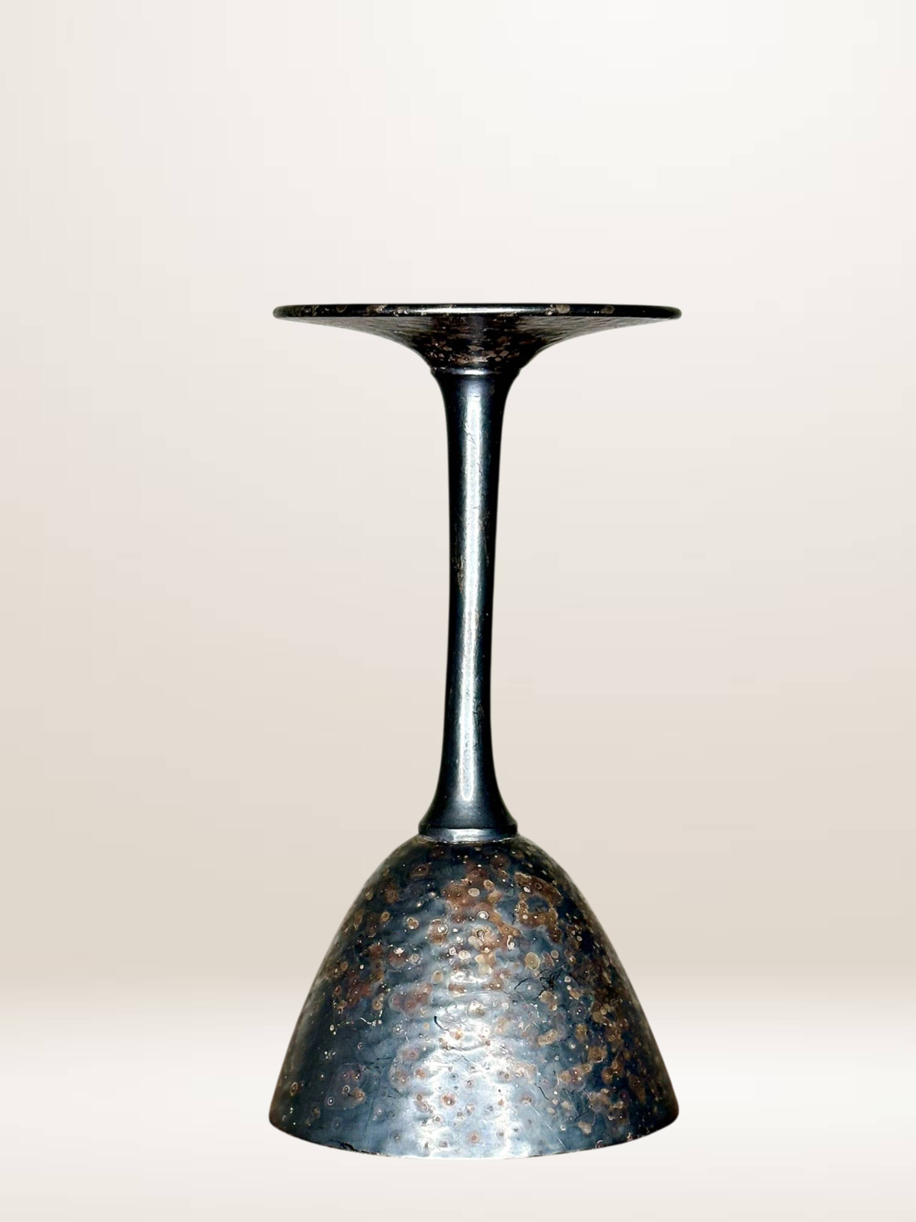 Set of six hammered metal goblets.