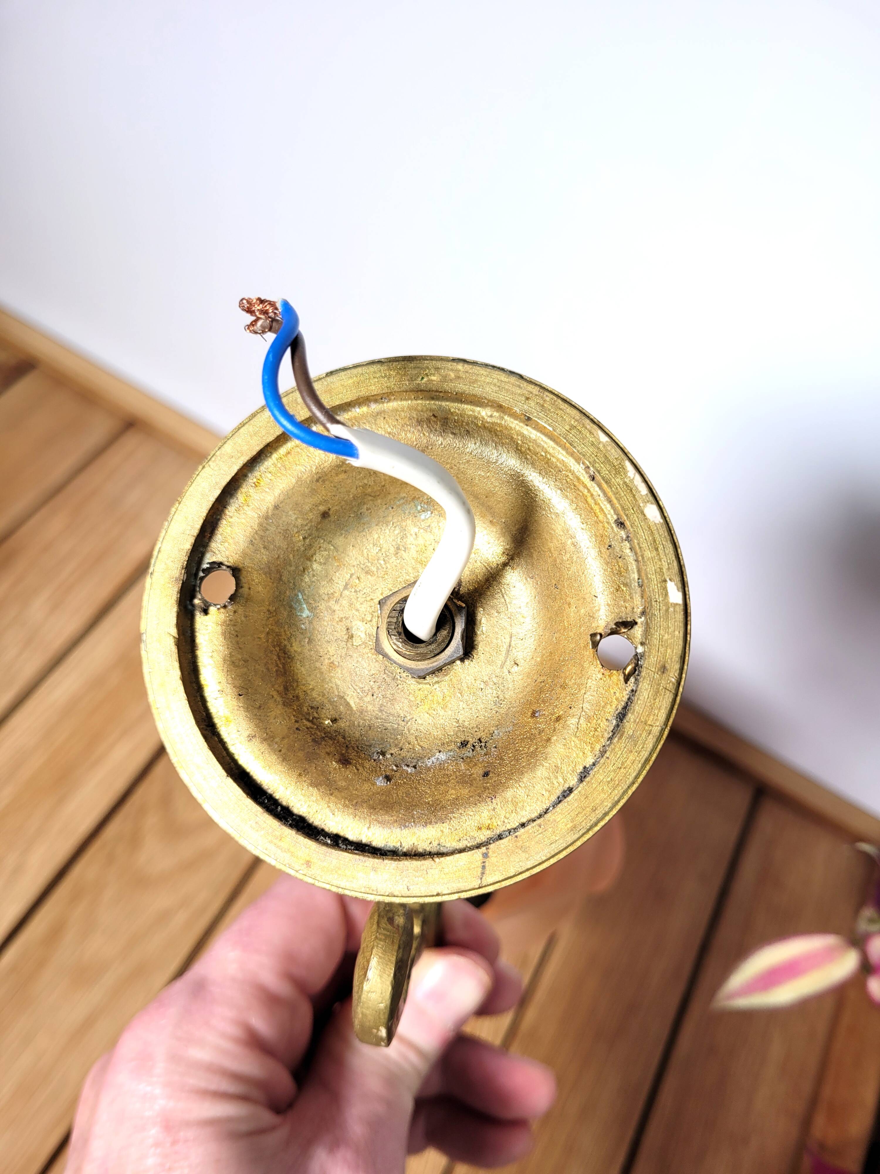 Old pink and golden brass wall lamp
