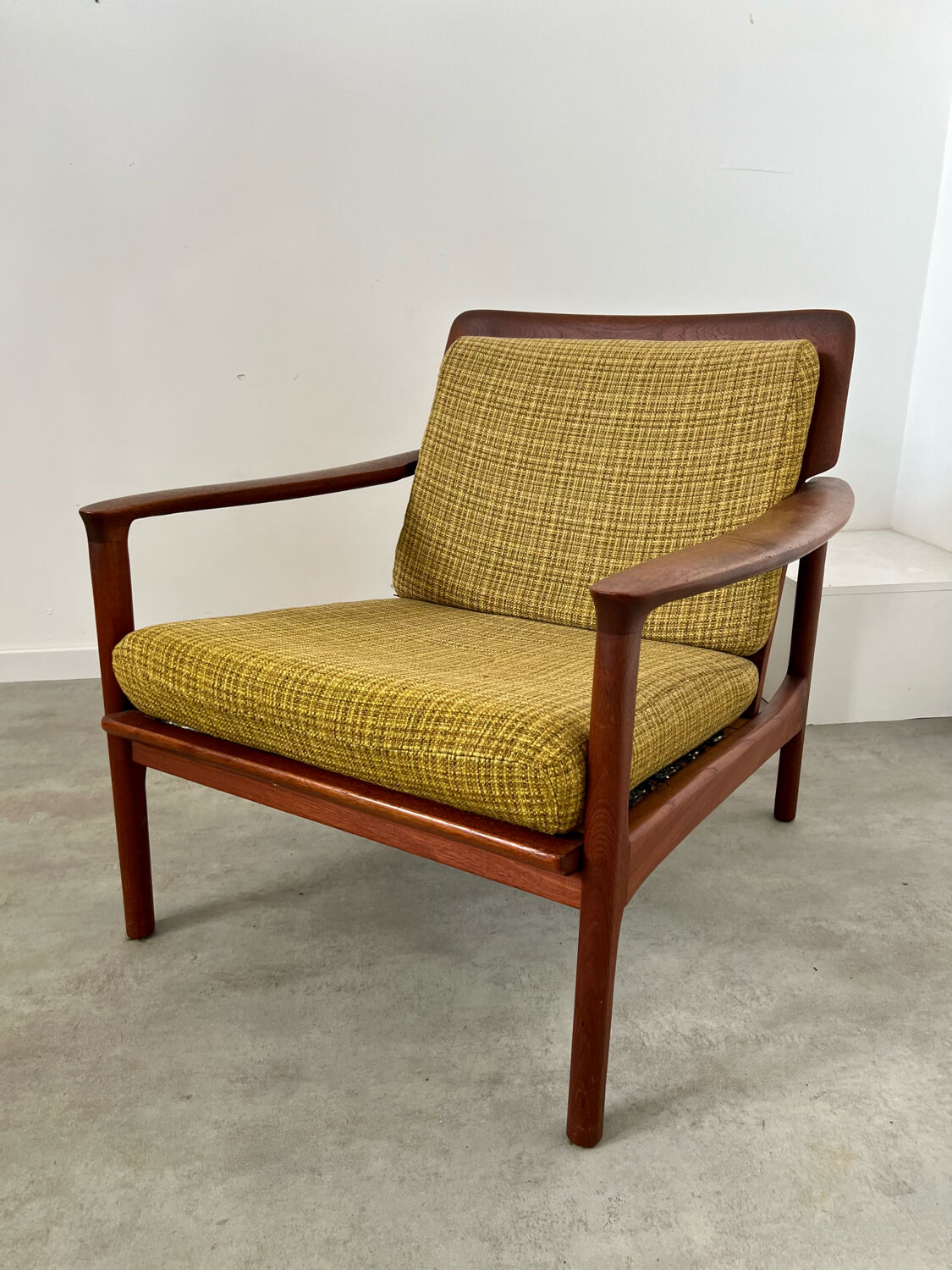 Old Scandinavian design armchair in vintage teak year 60