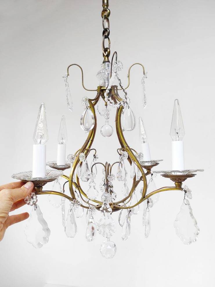 Old French chandelier in gilded brass with tassels