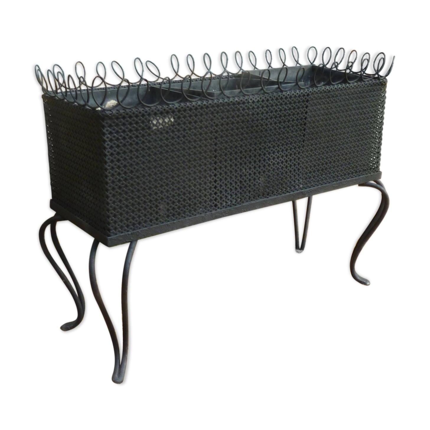 Black perforated metal planter from the 1950s