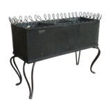 Black perforated metal planter from the 1950s