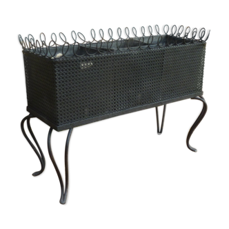 Black perforated metal planter from the 1950s
