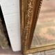 Louis XV style mirror in gilded wood and stucco, 20th century.