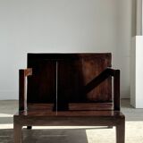 Small low armchair in varnished brown wood