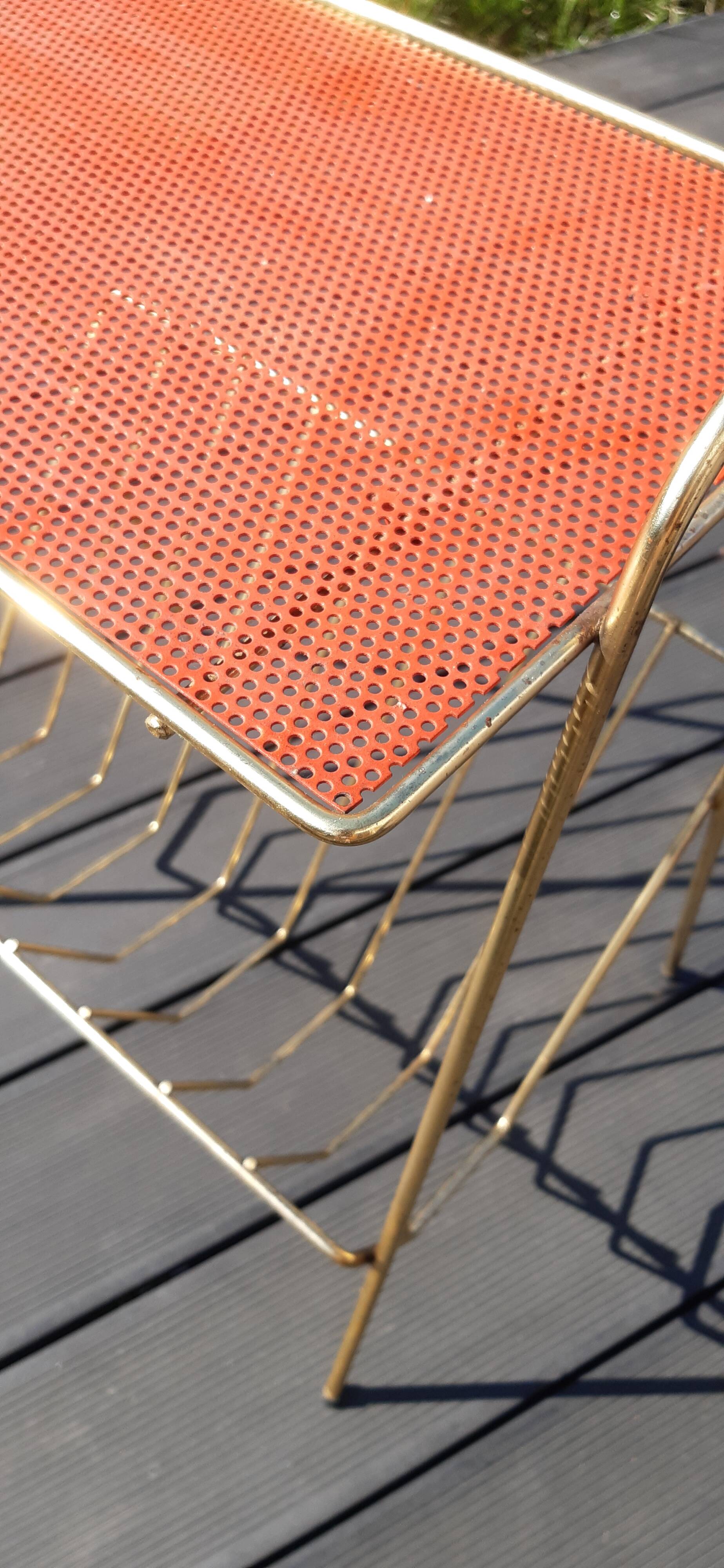 Perforated sheet metal magazine rack in the style of Mathieu Mategot, 1950s